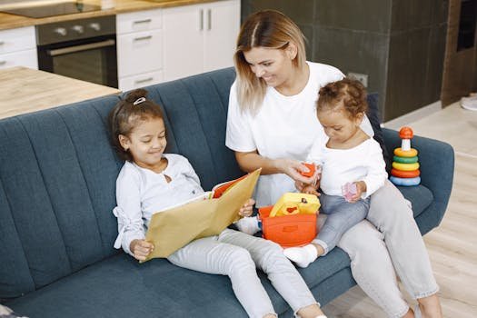 A mother reading with her daughters on a sofa, enjoying family time indoors.